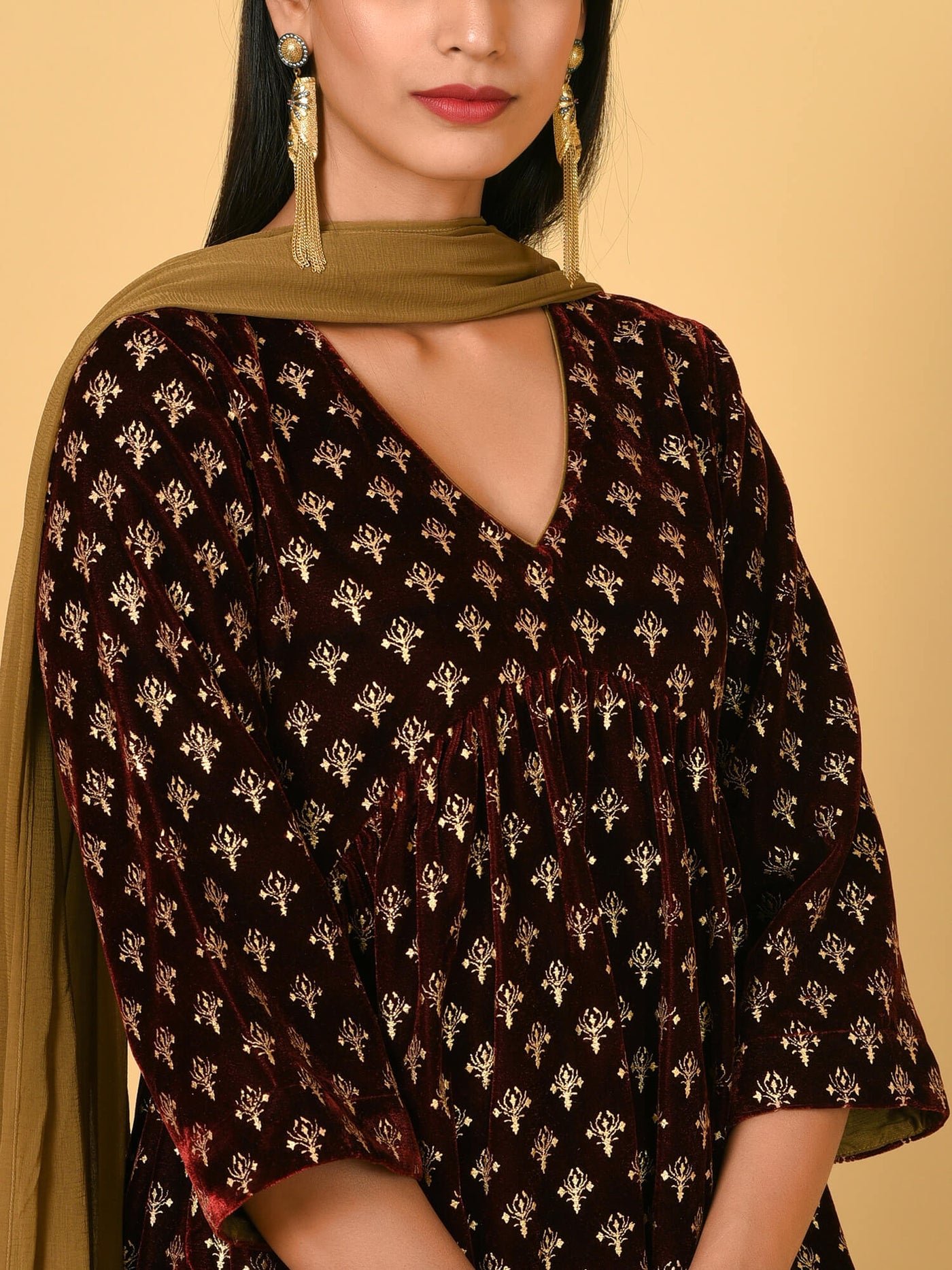 Spotlight in the Maroon and Gold Kurta Pant and Dupatta set